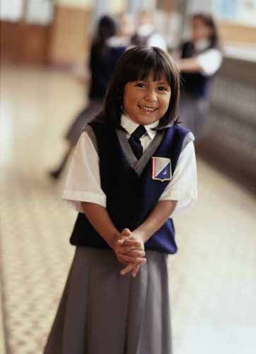 A student at a private school smiles